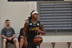 American import Kobe Powell takes the ball down the court for the Port Macquarie Dolphins in an early 2024 Waratah Basketball League clash. Picture by Emily Walker