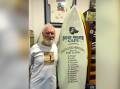 Ken Little with the Birdrock Memorial board at the Port Macquarie Surf Museum. Picture by Dan Little