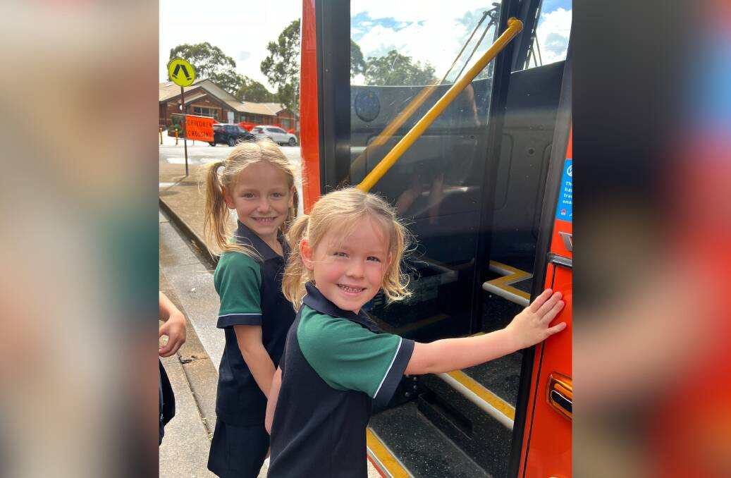 Marley and Olive learn about holding on for safety when you get on and off the bus. Picture supplied by Busways