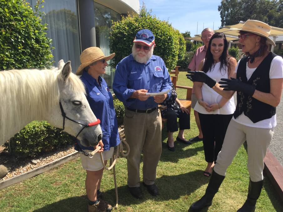 A horse of course: RDA Port Macquarie Wauchope's Dee and Robert Pike with Governor's Retirement Resort manager Angeline Mason and resident Philippa Reiss. And Nightmare the horse.