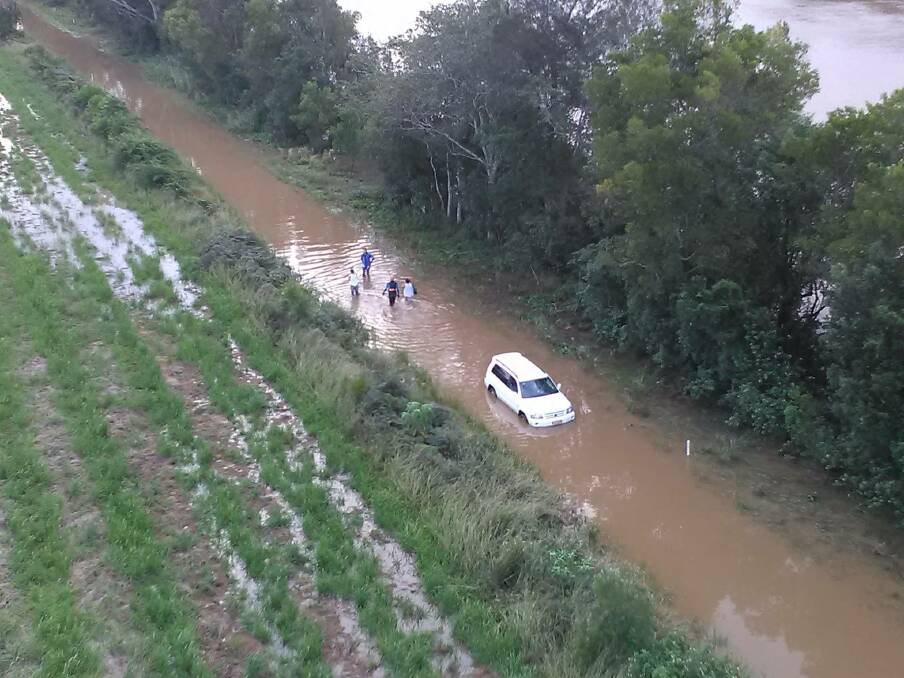 Flooded car: Port Macquarie SES assisted two people from this flooded vehicle at Telegraph Point. Pic SES