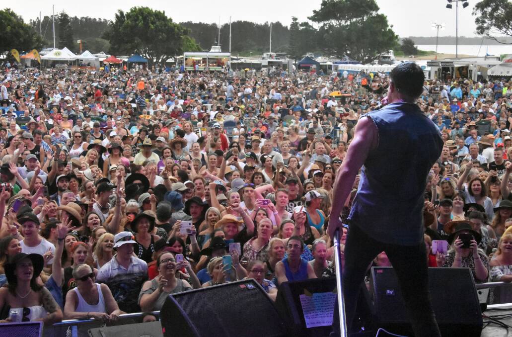 Red hot night: Shannon Noll playing to a packed house during the Red Hot Summer Tour in Port Macquarie on Saturday.