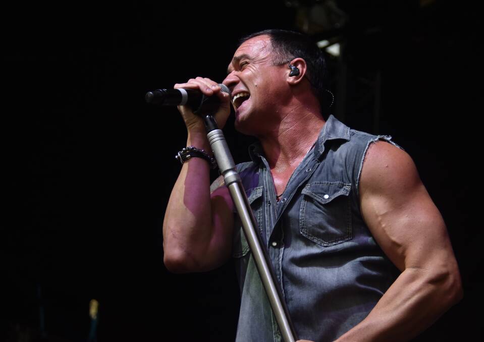 Giving it his all: Shannon Noll belting out a number during Saturday's Red Hot Summer Tour on Saturday.