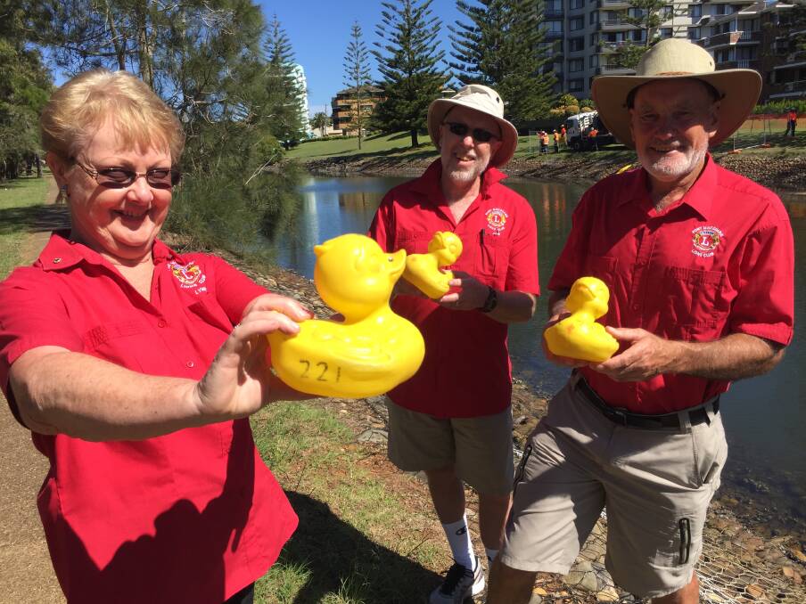 Duck race: Lions Club members Lynne Overton, John Fulton and Colin Hardwick say you can now buy your duck in preparation for the huge Duck Race on April 1. Photo: Peter Daniels
