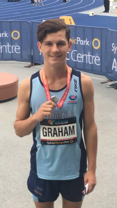 MEDAL WINNER IN SYDNEY: Long Flat's Nathan Graham has the athletics world at his feet after winning two silvers in the NSW competition in Homebush.