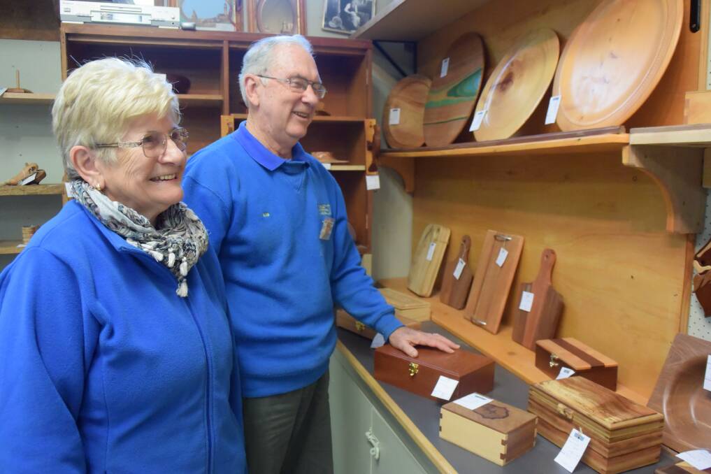 Stocking the shelves: Heather Jones and Bob Robinson selecting items for the Woodworkers' Guild's exhibition.