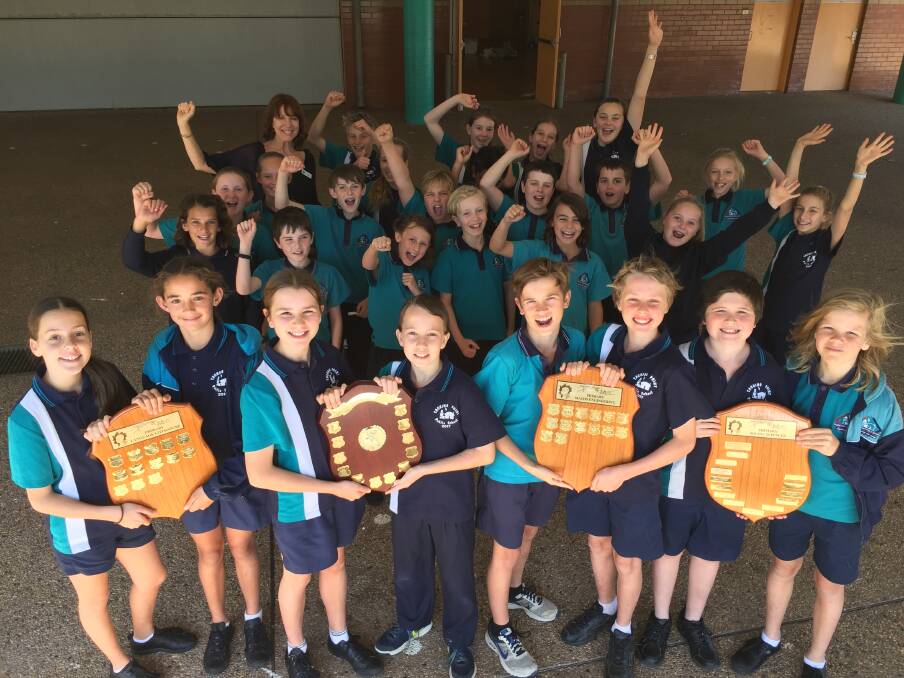 Creative thinkers: Tacking Point Public School students are preparing for Sunday's Tournament of the Minds at the University of NSW. Lottie Wilson, Olivia Oakeshott, Holly van der Veer, Zac Schneider, Daniel Norris, Evan Langstaff, Thomas Stanley and Bowen Lowrey hold the regional awards.