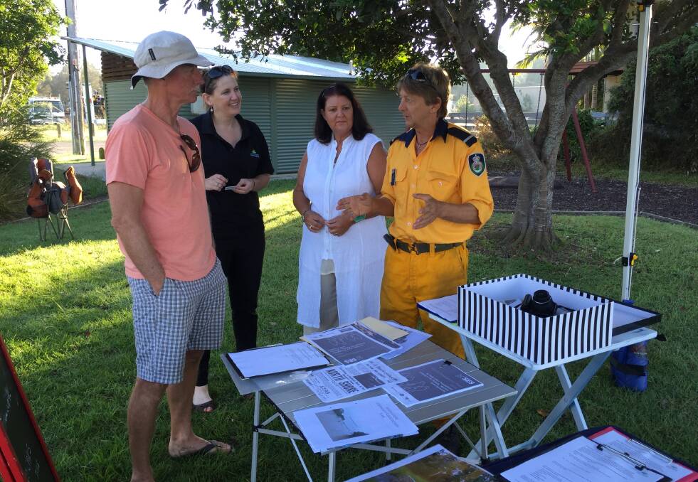Community news: North Shore resident Alan Carson, Port Macquarie-Hastings Council's Skye Frost and North Side Progress Association member Carla McKern and president Kingsley Searle discussing plans for the coal wharf in April this year.