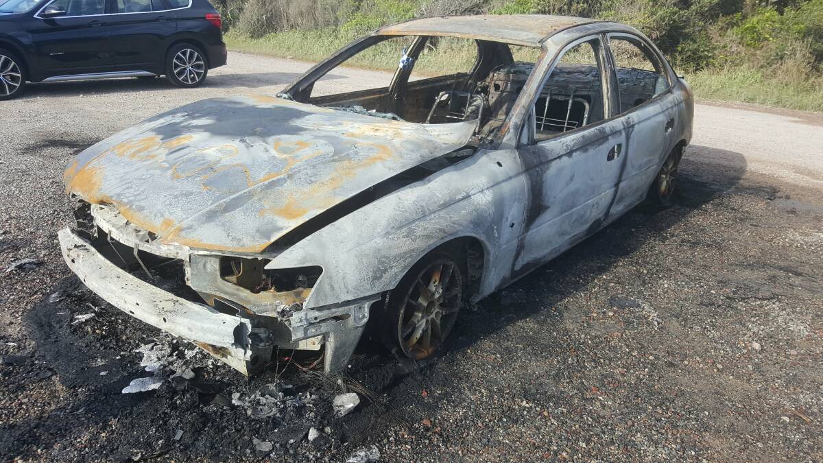 A wreck: A fisherman found his car alight at Middle Rock on Thursday December 28.