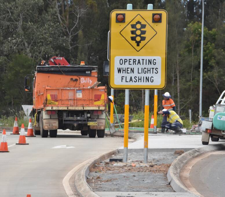 Sign of the times: Work on one of Port Macquarie's busiest intersections will include peak time traffic lights and slip lanes. Pic: Ivan Sajko