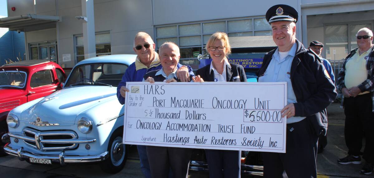 Fabulous support: Hastings Auto Restorers Society representative Ron ‘Rocket’ Turnbull, MNCCI Cancer Care Coordinator Ken Procter and Nursing Unit Manager Jenny Baroutis and SES Port Macquarie-Hastings Local Controller Ray Richards with the car club’s generous donation in support of cancer patients.