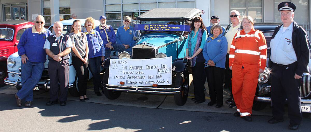 Great work: Representatives of the Hastings Auto Restorers Society, the Mid North Coast Cancer Institute and the local SES at the presentation of a $5500 donation in support of local cancer patients.
