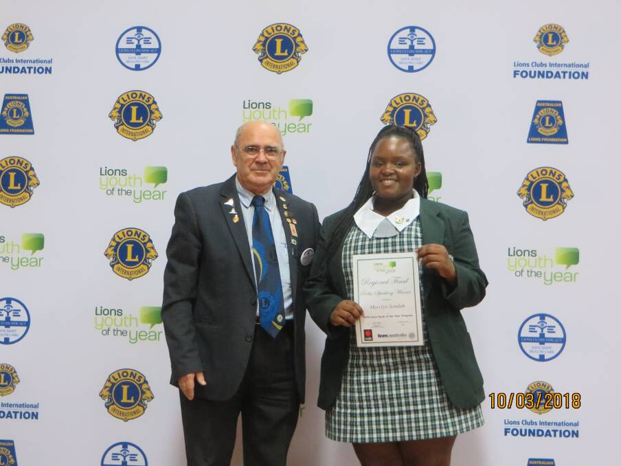 Winner: Regional Three chairman, Kevin Thornton congratulating Chatham High student, Marylyn Sendah on winning the public speaking section of the competition.

