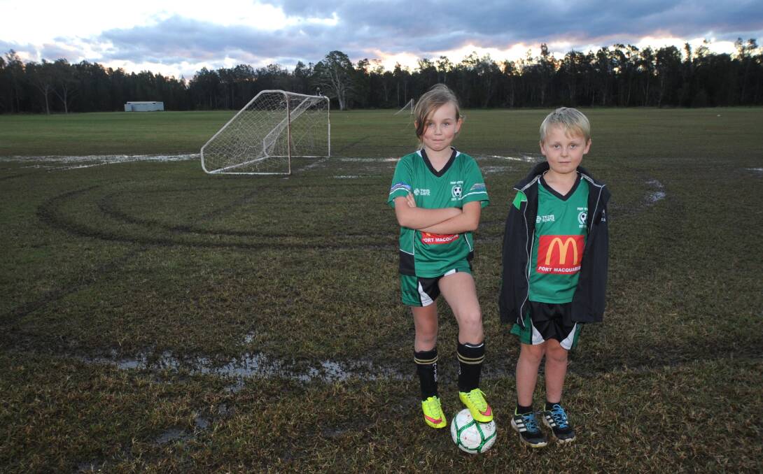 Will we play?: Sienna and Finn Oxley contemplating the chances of playing this weekend after their pitches were vandalised. Pic: Ivan Sajko