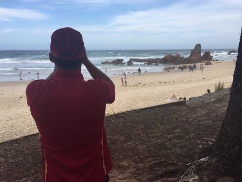 Search starts: Lifeguards and emergency services are searching for a swimming, believed missing off Flynns Beach.