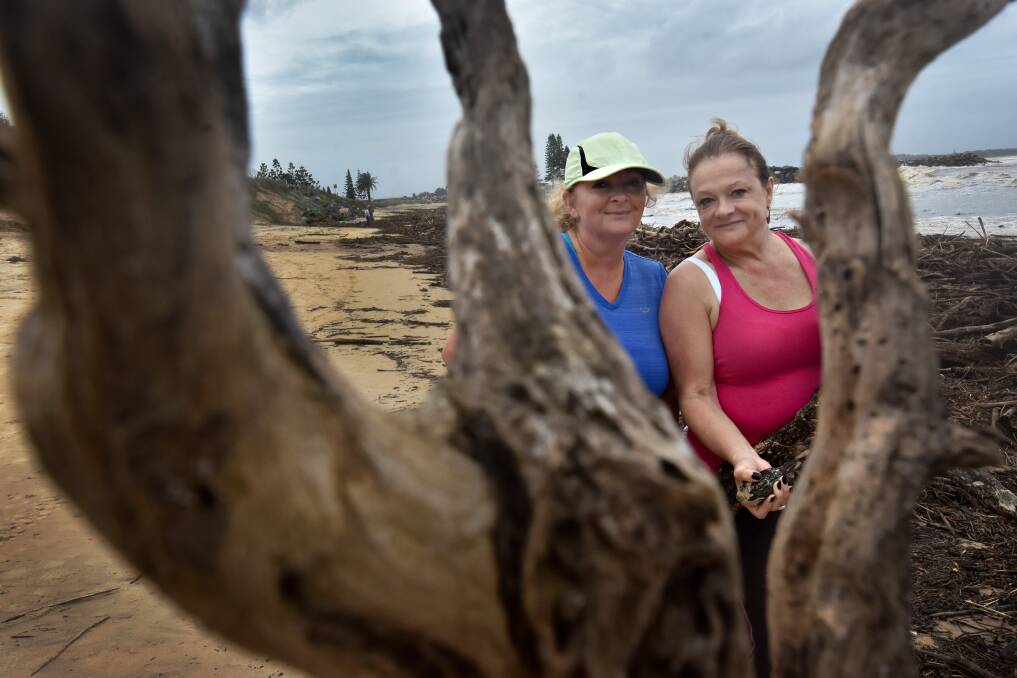 Find that inspiration: Sisters Lindy McKinnon and Maree Watkins were gathering pieces of wood from the debris on Town Beach on Monday. Pic: Ivan Sajko