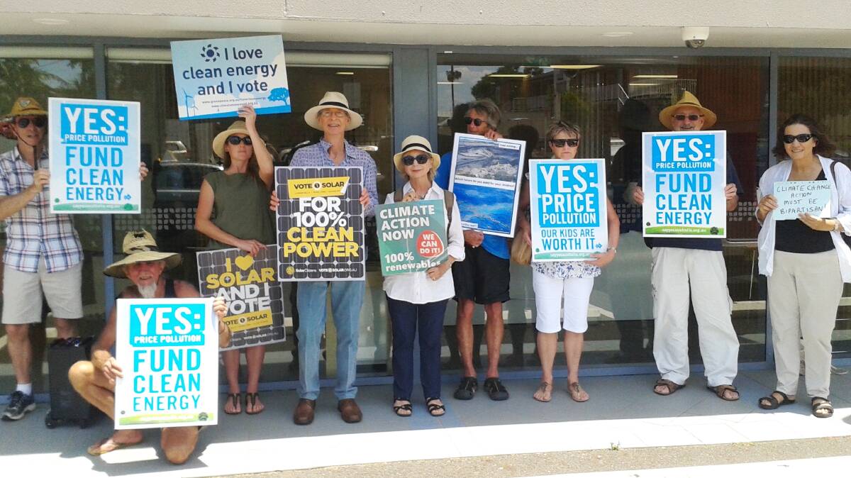 What do we want?: Climate Change Australia – Hastings Branch president Harry Creamer (fourth from left) leading the charge against higher electricity pricing in Port Macquarie on December 14.