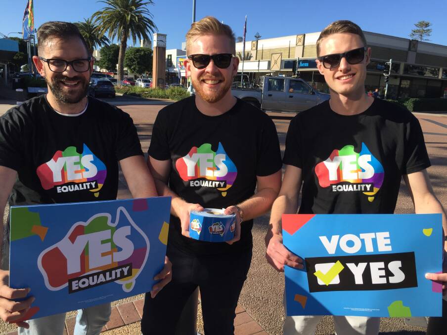 Yes vote: Theo Comino, Andrew Moore and Mitchell Clout supporting the marriage equality yes vote in Port Macquarie on Friday.
