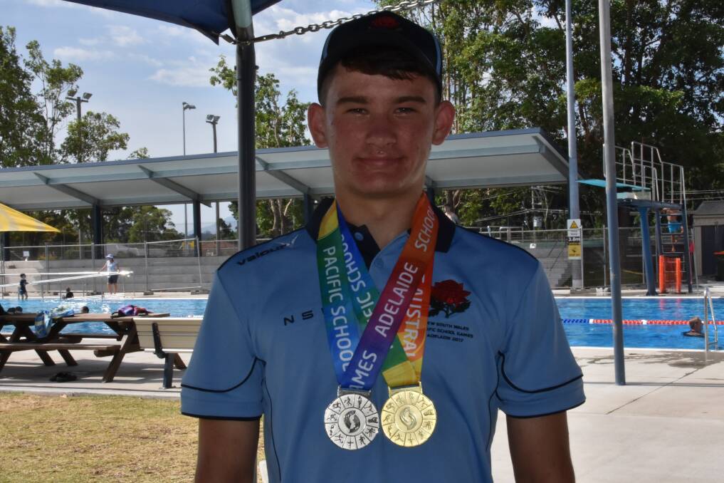 Morgan with his gold and silver medals from Adelaide.