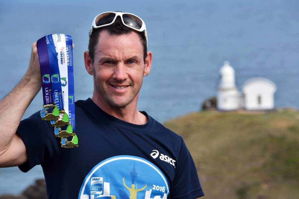 Up for grabs: Beach to Brother organiser Michael Maher with the medals the winners will receive on Sunday. Photo: Ivan Sajko.