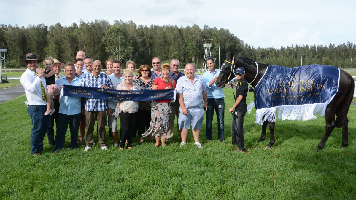 Winners are grinners: The successful syndicate after Sunday's win in Taree.