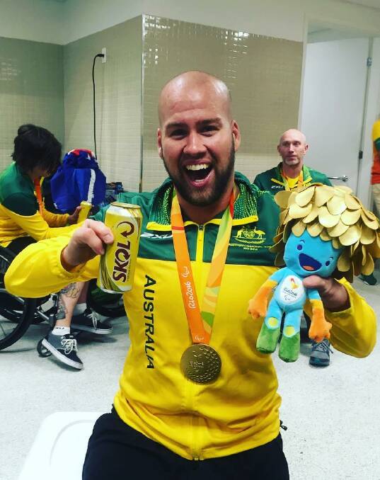 Loving life: Ryley Batt in the dressing rooms moments after Australia claimed back-to-back gold medals. He says it still hasn't sunk in.