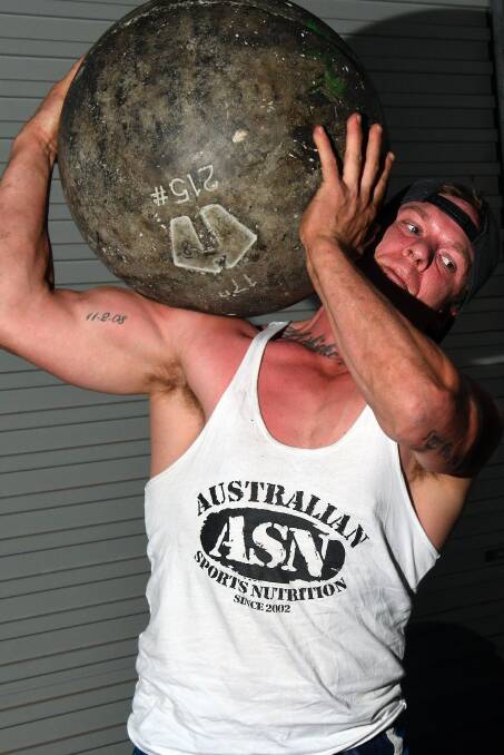 Heavy lifting: Murray Joyce currently holds the Australian record for lifting an Atlas Stone. Photo: Ivan Sajko