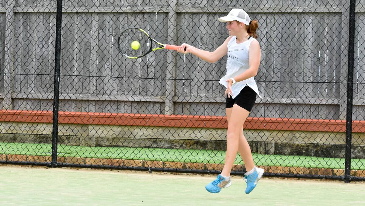 Hit it: Niamh Cargill from Port Macquarie plays a forehand during Sunday's action at Eastport Tennis Club. Photo: Ivan Sajko