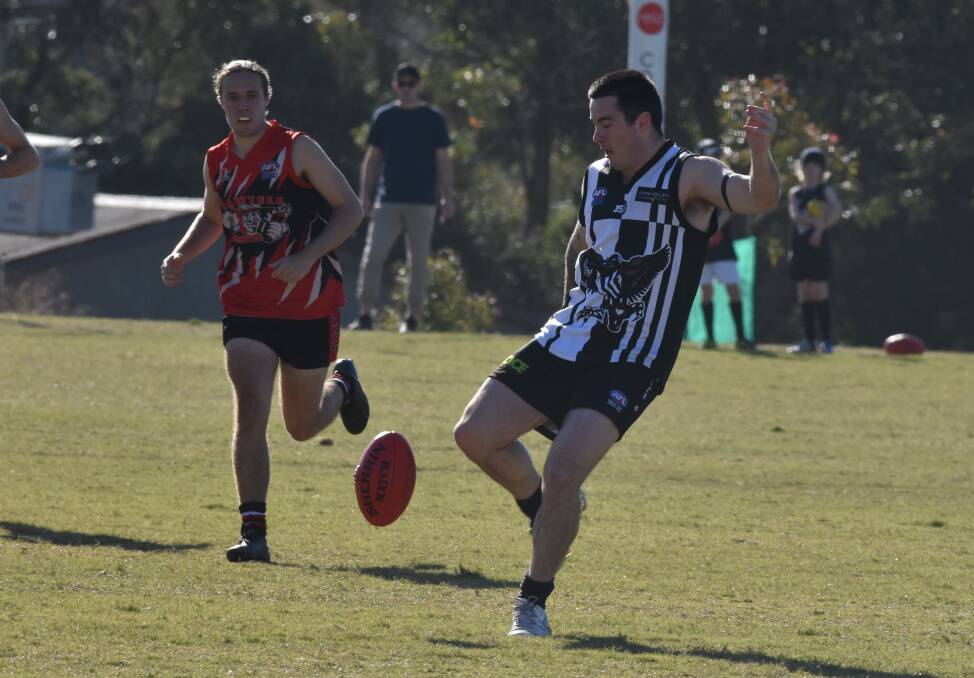 Boot to ball: The Magpies Luke Long clears a kick downfield during last week's clash with Sawtell. Photo: Ivan Sajko