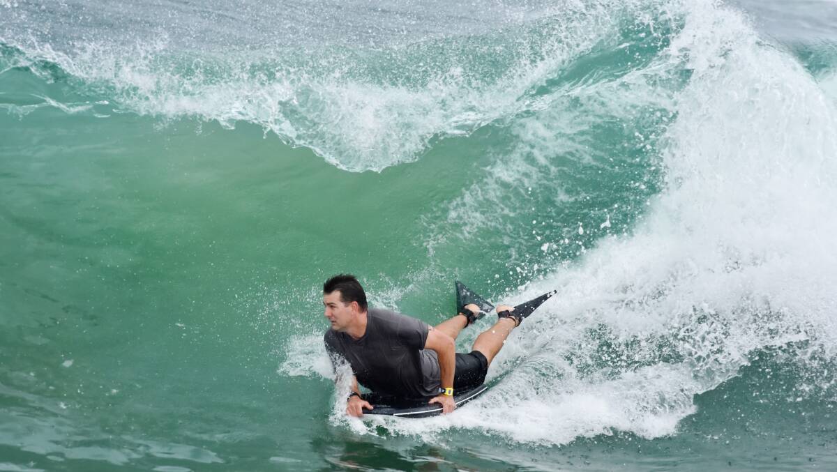 Fun and games: Port Macquarie bodyboarder Luke Filipek catches a wave at Town Beach. Photo: Ivan Sajko