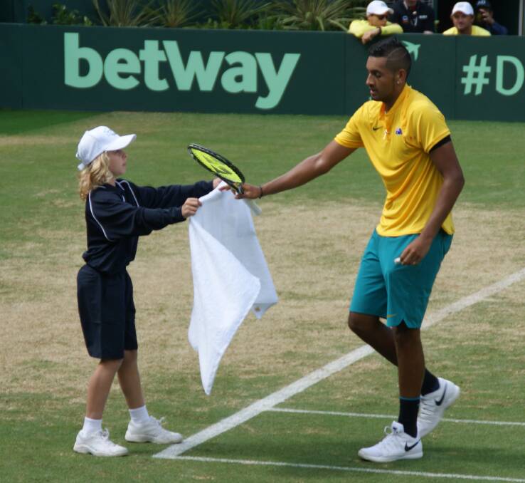Great experience: Rhyan Hudson hands Nick Kyrgios his towel at the Davis Cup last weekend.