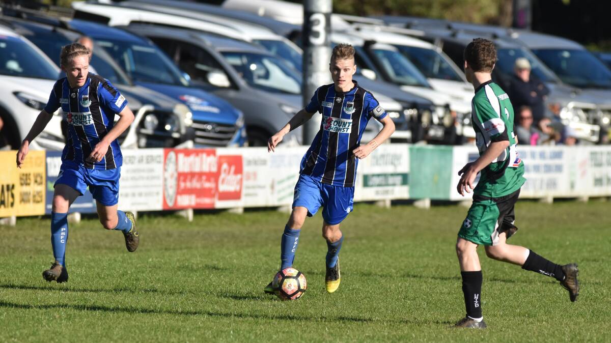 Take him on: Port Saints midfielder Michael Bishop takes on the Port United defence in their 2-1 win a fortnight ago. Photo: Ivan Sajko