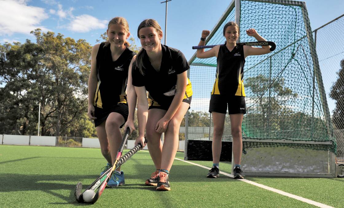 Successful: Port Macquarie-Hastings hockey players Amy Winterton, Abbie Jenner and Lucy Chappell are state age champions. Photo: Paul Jobber