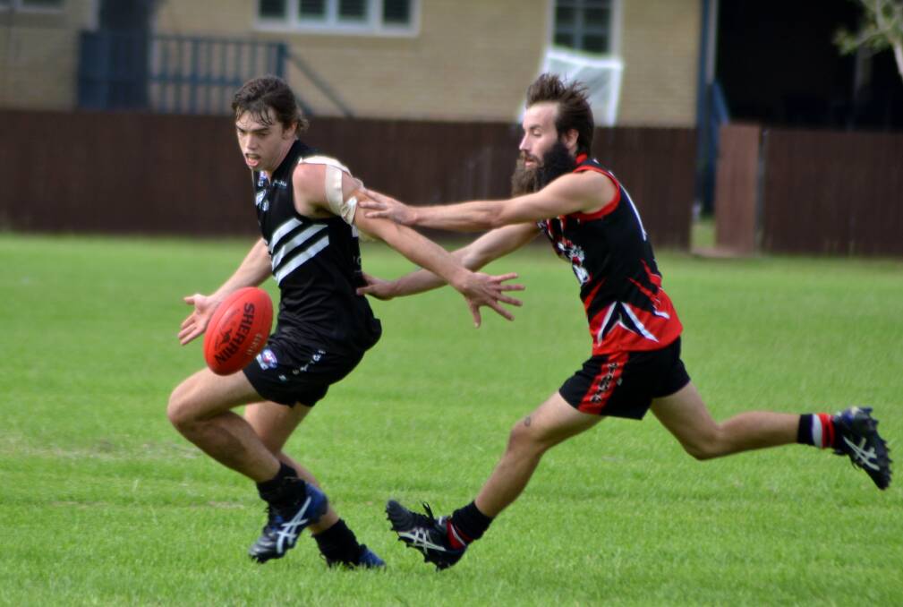 Chasing the game: Dylan Beasley fights for possession earlier in the season. Photo: Donna Lynch