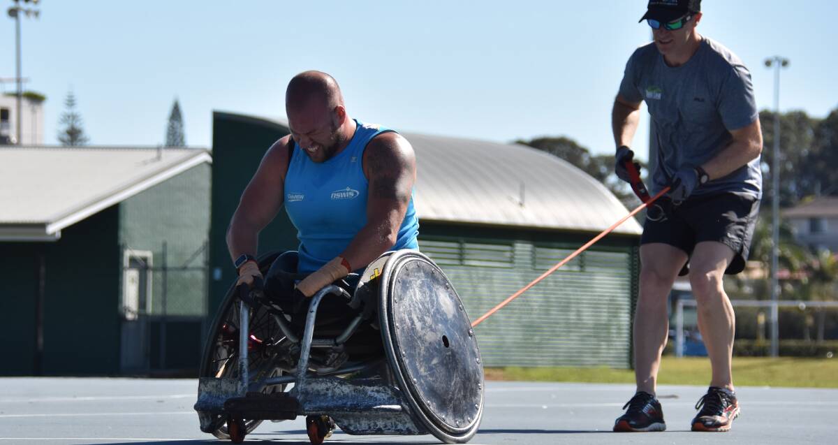 Sweat it out: Ryley Batt puts in the hard work ahead of the Rio Paralympics with personal trainer Tony Lineham. Photo: Ivan Sajko