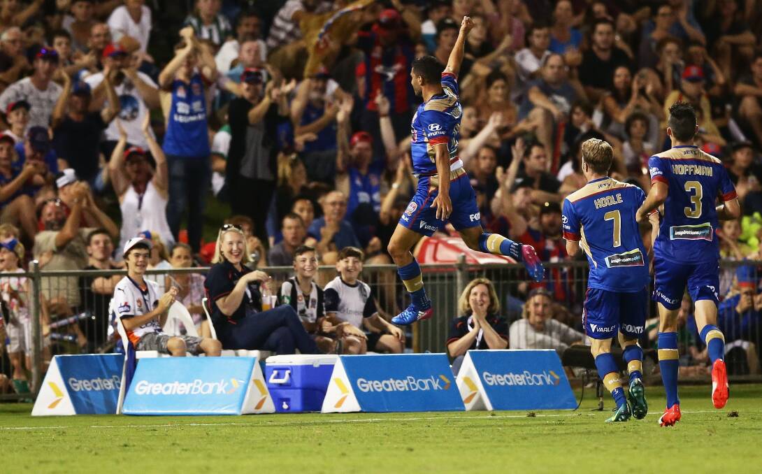 Victory: Andrew Nabbout, Andrew Hoole and 
Jason Hoffman of the Jets celebrate a win in Coffs Harbour.