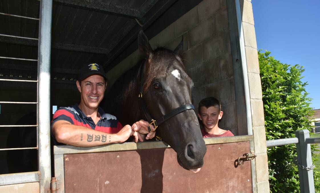 Big win: Trainer Marc Quinn, apprentice trainee Liam Blanch and Cogliere at Quinn's Port Macquarie stables following Saturday's win at Randwick.