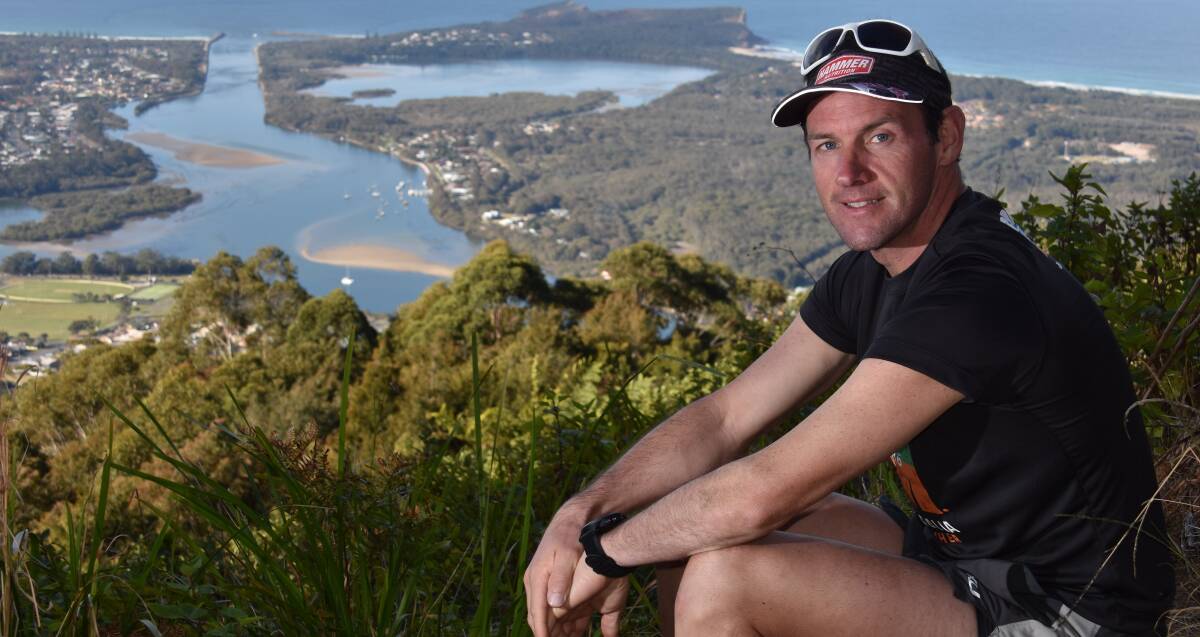 Worth the hard work: Beach to Brother organiser Mick Maher at the top of North Brother Mountain. Photo: Ivan Sajko