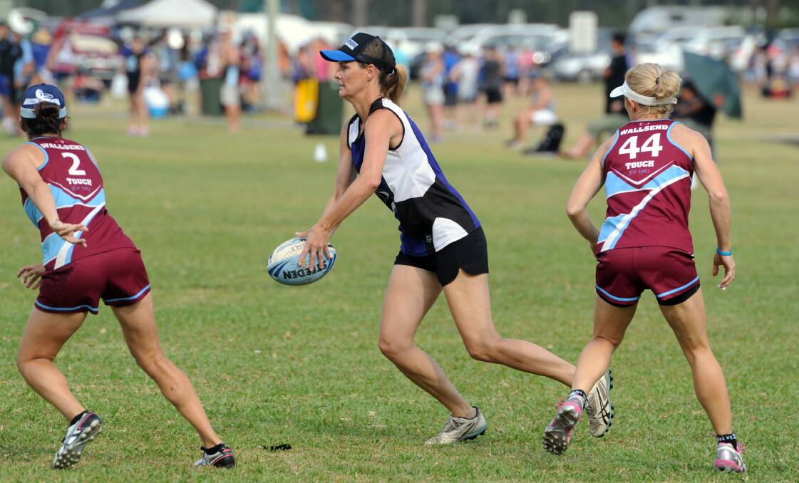 Where's the support: Kobie Knight looks for a teammate in the women's over 30s clash with Wallsend. Photo: Ivan Sajko