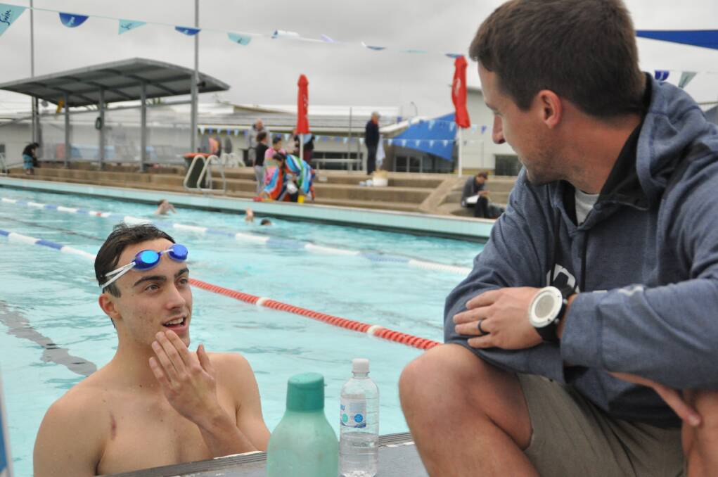 Willing to learn: Tom Berryman receives advice from NSWIS biomechanist Ryan Hodierne on Tuesday.