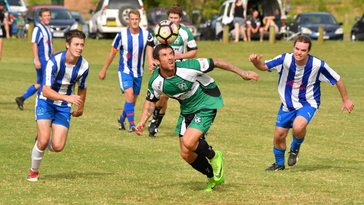 Balancing act: Adam Woonton heads the ball during Port United's trial win over Garden Suburb.