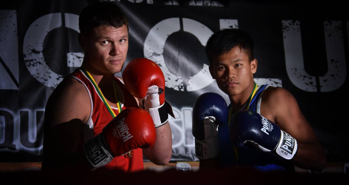 Winners: Scott Chessells and Darm Phakphai took home gold at the Golden Gloves in Brisbane. Photo: Ivan Sajko
