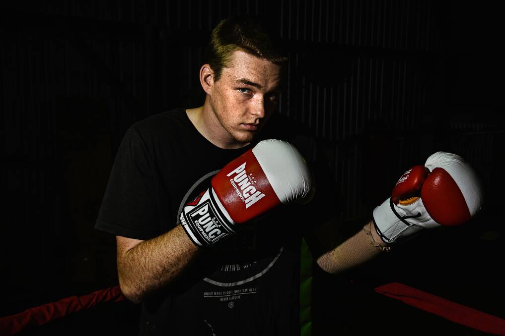 Title winner: Port Macquarie Boxing Club's Hugh Campbell won his first novice heavyweight title in Sydney last weekend. Photo: Ivan Sajko