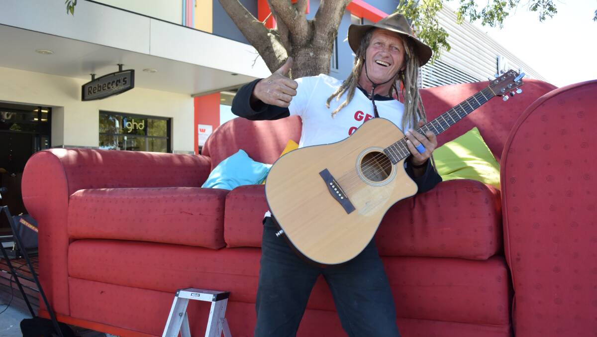 Thumbs up: Michael the Living Poet came through Kempsey as part of his Great Australian Couch Tour. Photo: Lachlan Leeming. 