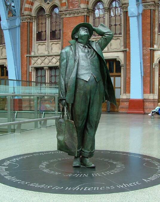 Stopped in his tracks: Martin Jennings' whimsical larger-than-life statue of Poet Laureate Sir John Betjeman seeing St Pancras station for the first time. 