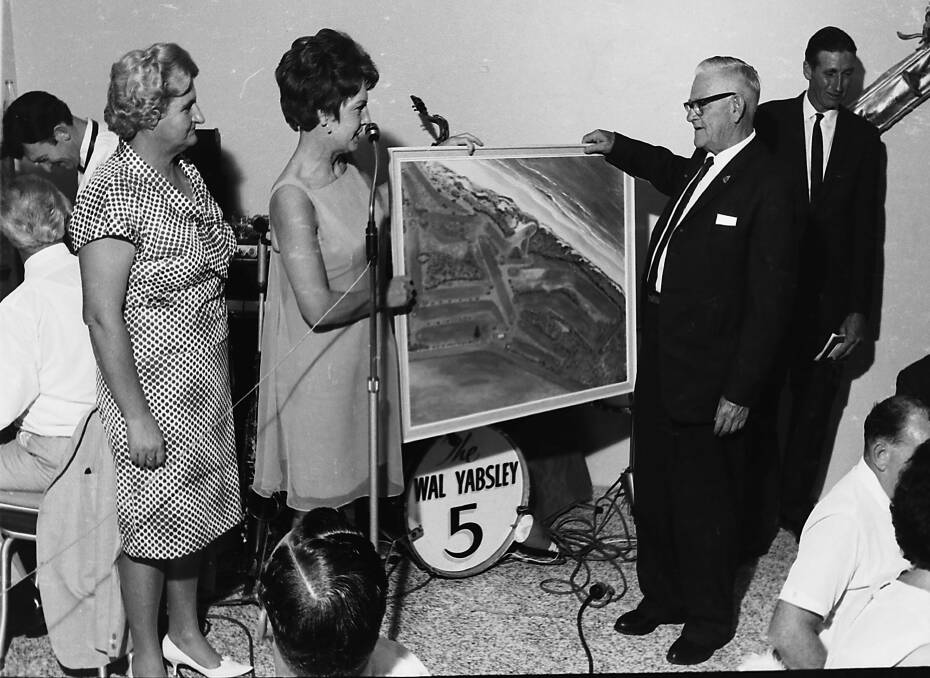 Gift: Una Robertson presents her painting of the new golf course to club president Jack Pike, along with associate president Enid Hudson, 1968.