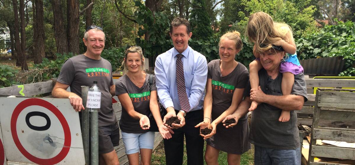 Good soil: Cowper MP Luke Hartsuyker gets his hands dirty with members of The Lost Plot community garden at Port Macquarie, to mark World Soil Day.