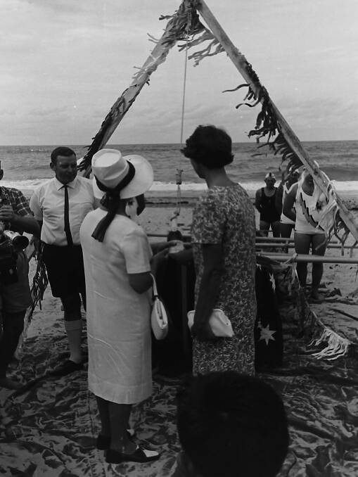 Surf's up: Mrs Hennessy and Mrs McClelland christen the new surf boat John Oxley at Flynns Beach, 1967.