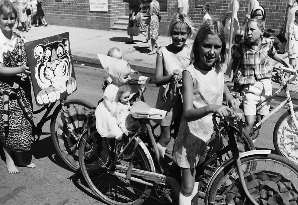 Crafty endeavour: These youngsters show off their handiwork decorating their bicycles to take part in the 1967 street parade celebrating the Carnival of the Pines. 