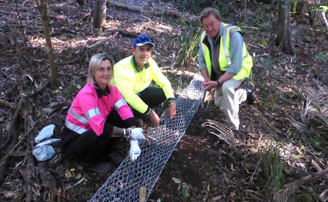 ETC members with Walker Coull, who have all been working on the western side of Kooloonbung Creek Nature Park, overseen by council’s Parks and Recreation projects officer Mike Olzomer.